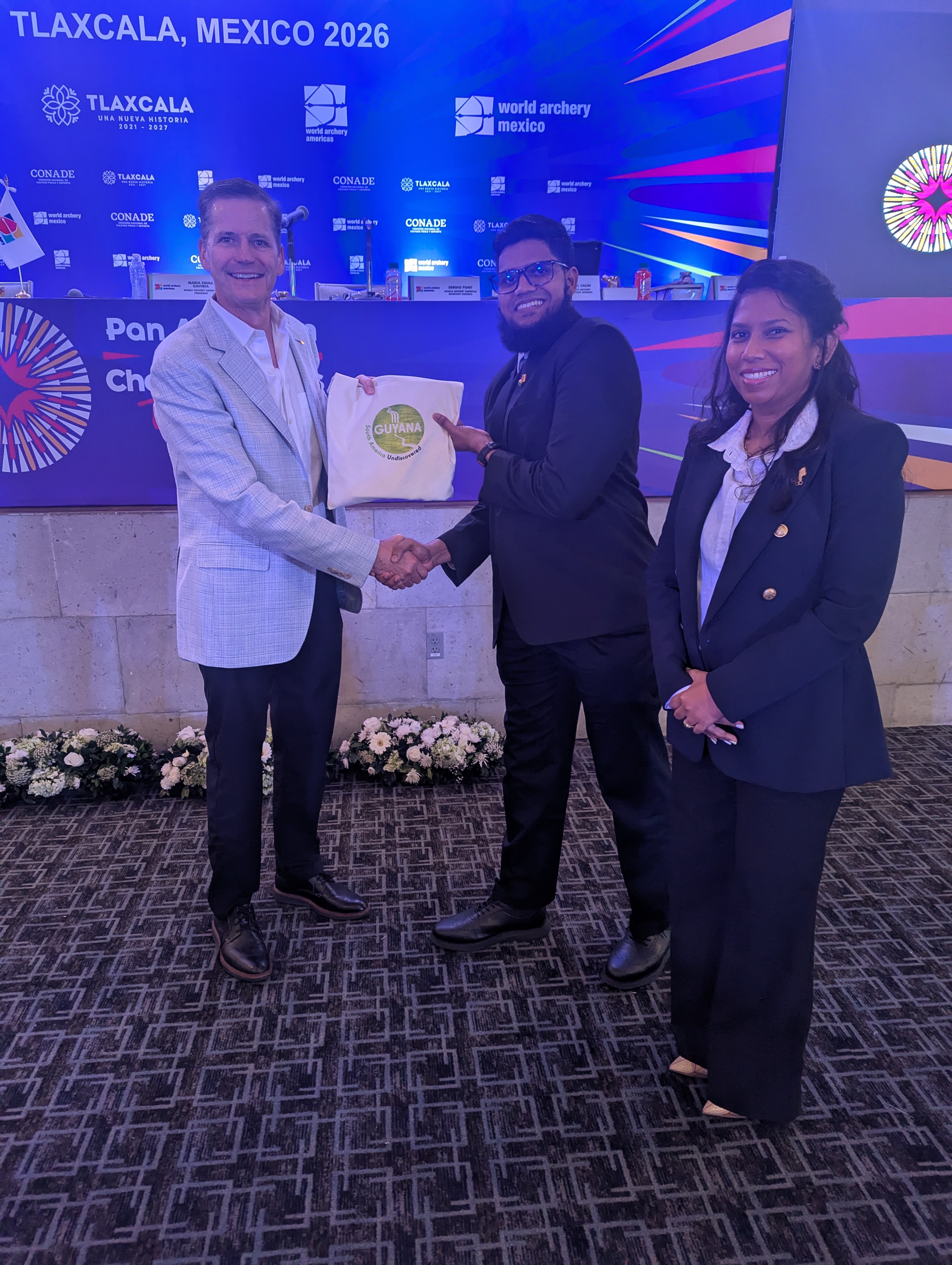 Archery Guyana Presenting World Archery President Mr Greg Easton with Tokens from Guyana