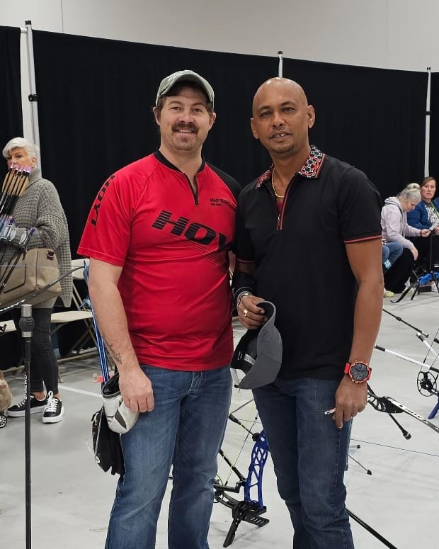 Guyanese Archer Mahendra Chatargum poses with fellow archer at 20th Lancaster Archery Classic hosted at the Spooky Nook Sports Complex in Manheim, Pennsylvania.